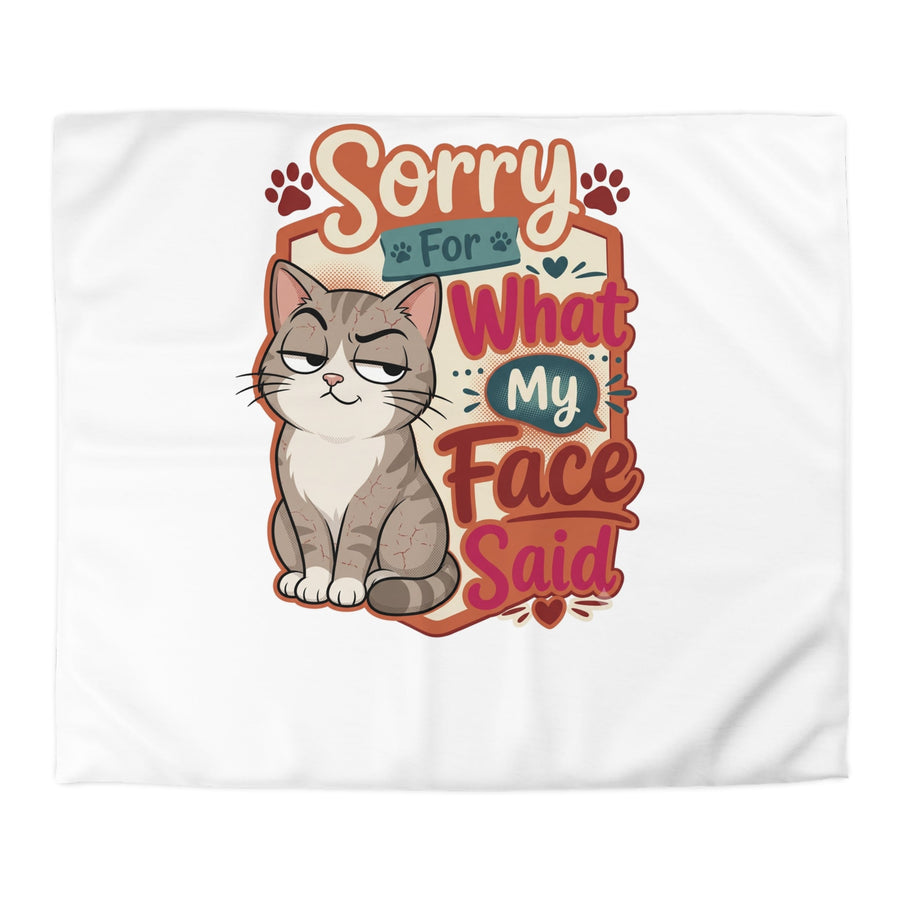Sorry for What My Face Said duvet cover on a bed in a bedroom, angled view (mockup)